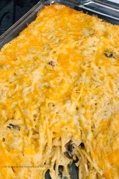 a casserole dish with cheese and other toppings