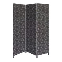 a black and white room divider with geometric designs