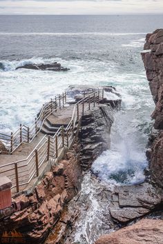 the steps lead down to the water from the cliff