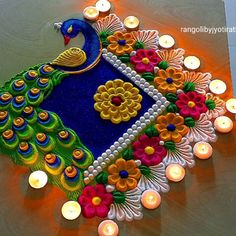 a peacock made out of flowers and candles