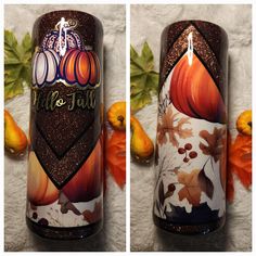 two candles decorated with fall leaves and pumpkins