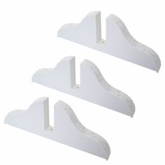 three white shelf brackets with decorative designs on them, set of 3 - view 1