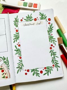 an open christmas planner with markers and crayons on the table next to it