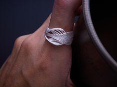 This Multi Wire Sandblasted 925 Sterling Silver Ring is a handcrafted, adjustable open ring. With its modern wraparound design, it makes the perfect dainty statement piece or Christmas gift for her. ☘️ Size: Open ring (Adjustable size), Recommended fit for size 5-6 (49-52) ☘️ Other Considerations: - Comfort Assured: My handmade jewelry is nickel-free and hypoallergenic, making it safe and comfortable for all skin types. - Worry-Free Returns: If you're not satisfied for any reason, I offer a 14-d Unique Silver Open Ring Jewelry, Artistic Handmade Open Ring Jewelry, Artistic Handmade Open Ring, Handmade Modernist Open Ring Jewelry, Modernist Sterling Silver Open Ring, Opt Art, Handmade Silver Ring, Silver Rings Handmade, Open Ring