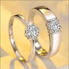 two wedding rings with diamonds on them