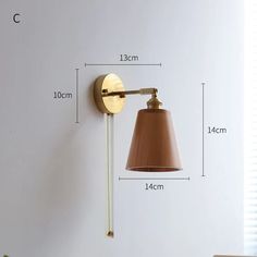 an image of a wall light with measurements for the size and width on white background