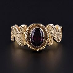 This Victorian era, antique ring (circa 1860-1870) features a rhodolite garnet set in hand engraved 9ct gold. The inside of the band bears the initials 'JY'.  The ring is a size 9.5, but it can be re-sized free of charge.  It is in excellent condition; however, the garnet is a later replacement and not original to the ring.  We have many other fantastic offerings of antique and vintage jewelry posted on our Etsy store, so please consider browsing our other items. We send all items in individually packaged gift boxes and offer layaway plans! + Trademark Antiques Shop Homepage https://www.etsy.com/shop/TrademarkAntiques + Our Store Policies https://www.etsy.com/shop/TrademarkAntiques/policy?ref=shopinfo_policies_leftnav + Connect with us on Social Media (Get access to monthly giveaways, spec Victorian Yellow Gold Ruby Ring With Intricate Design, Victorian Ruby Ring In Yellow Gold With Intricate Design, Victorian Engraved Yellow Gold Ring, Victorian Yellow Gold Ruby Promise Ring, Antique Ruby Signet Ring, Antique Hallmarked Ruby Signet Ring, Victorian 14k Gold Engraved Ring, Victorian 14k Gold Ruby Ring With Intricate Design, Victorian Oval Ruby Ring