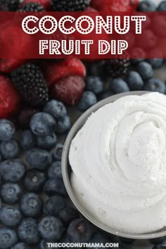 coconut fruit dip in a bowl surrounded by berries and raspberries with text overlay