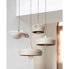 three lamps hanging from the ceiling in a room