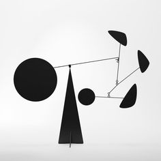 a black and white photo of an abstract sculpture with circles, shapes, and lines