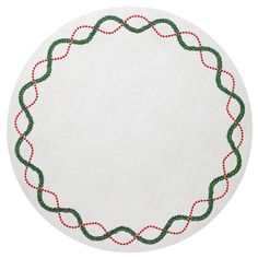 a white circle with green and red trimmings in the center on a white surface