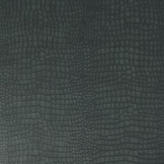 the texture of an alligator skin pattern is shown in dark green color, with small squares on