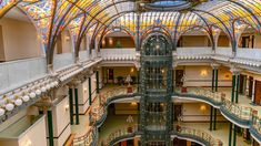 the inside of a large building with many windows and balconies on each floor