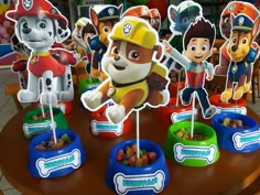 paw patrol cupcake toppers are on display at a children's birthday party