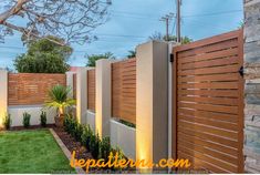 a fenced in backyard with grass and trees