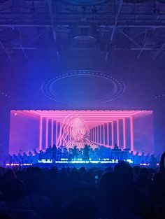 the stage is lit up with colorful lights