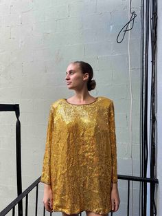 Vintage gold sparkly t-shirt  Model usually wears a size M (5'11 141lb) can fit a size L Fall Party T-shirt With Sequins, Long Sleeve T-shirt For Fall Party, Glitter Crew Neck Tops For Night Out, Yellow Long Sleeve Party Tops, Party Season Sequined Crew Neck T-shirt, Gold Tops For Party Season Night Out, Yellow Sequined Top For Party, Gold Long Sleeve Tops For Night Out, Yellow Party Tops With Sequins