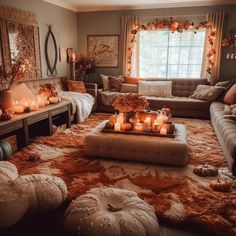 a living room filled with lots of furniture and candles