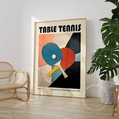 a table tennis poster on the wall next to a wicker chair and potted plant