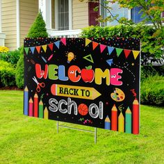 a welcome back to school sign in front of a house