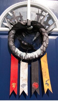 an image of a wreath with flags hanging from it's front door entrance to a building