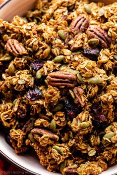 a bowl filled with granola and nuts