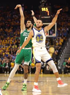 two basketball players in action on the court