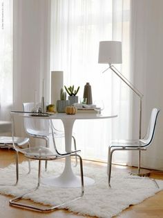 a white table and chairs in a room