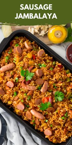 sausage jambaalaya in a baking dish with garnishes on the side