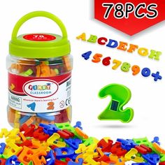 a jar filled with colorful plastic letters and numbers next to a red sign that says topps