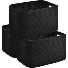 two black storage baskets sitting next to each other