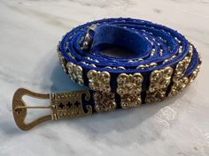 This is a very BLUE and beautiful plaque belt / girdle, about 5/8" wide and 60" long, with 74 studs down the entire length. Such long belts were worn by medieval noblewomen to show their status and wealth; plus the long belts accentuated the hips. This beautiful custom blue one is fitted with our highly detailed buckle and matching tip, and is ready to come home with you! The pictures of the black belt at the end of the sequence show what the optional gold plate can do for the best - besides making it POLISH-FREE! Gold plating available as an add-on. Costume Wedding, Larp Costume, Passover, Come Home, Blue And Gold, Adult Costumes, Larp, Black Belt, Gold Plating