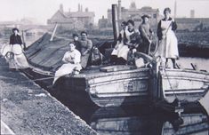 an old black and white photo of people on a boat