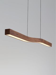 a wooden light fixture hanging from the ceiling