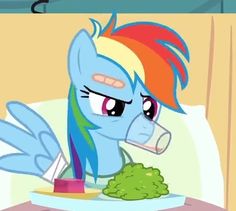 the pony is eating broccoli on the bed with its tongue out and eyes wide open