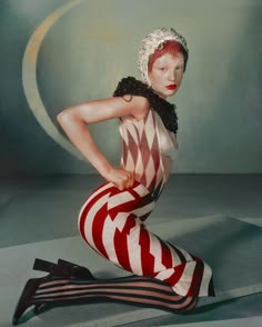 a woman with red and white stripes on her body