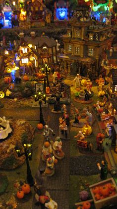 an aerial view of a halloween village with pumpkins and other decorations on the ground