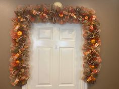 a door decorated with oranges and bows