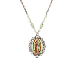 The uniquely designed necklace featuring the manifestation of Mary in a traditional star embroidered blue gown. Her hands are clasped in prayer and beneath her feet rests an infant; representing Senora Nuestra de Guadalupe as the protector of the innocents. The floral pendant dangles from a 28 inch double curb knurled steel chain with lobster clasp and accented with round smooth green beads & flower beads. The uniquely designed necklace featuring the manifestation of Mary in a traditional star e The Innocents, Symbols Of Faith, Beads Flower, Our Lady Of Guadalupe, The Protector, Lady Of Guadalupe, Blue Gown, Floral Pendant, Green Beads