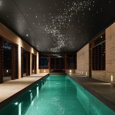 an indoor swimming pool with the words dreams can be reality above it and below it