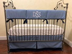 a baby crib with the name dss on it