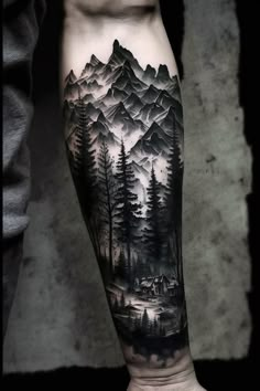 a man's arm with mountains and trees on it