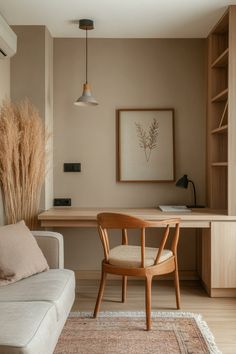 a living room with a couch, chair and desk