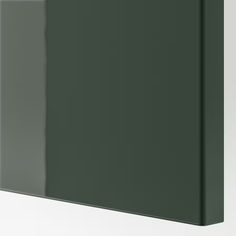 a dark green wall mounted cabinet with two doors on the front and one door in the back