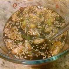 a glass bowl filled with food on top of a counter