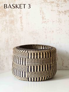 a black and white basket sitting on top of a table