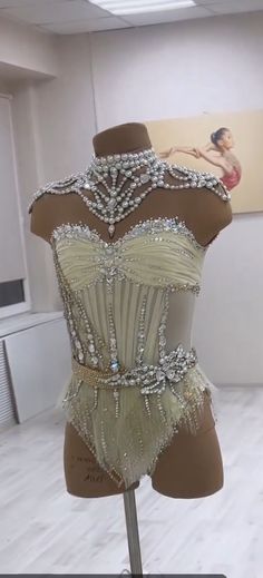 a mannequin with beaded and sequins on it in a room