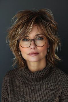 Choose from hairstyles that offer a tousled, voluminous look with subtle layers and dynamic highlights, perfect for any woman over 50 looking to pair her hairstyle with stylish glasses. Shag Haircut With Glasses, Tousled Hairstyles, Fine Hair Bangs, Subtle Layers, Women Haircuts, Messy Bob Hairstyles, Sophisticated Hairstyles, Shaggy Short Hair, Hairstyles For Women Over 60