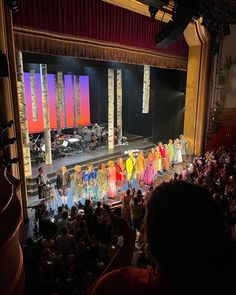 a group of people standing on top of a stage