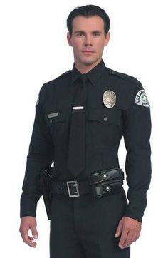 a man in a police uniform is posing for the camera with his hands on his hips